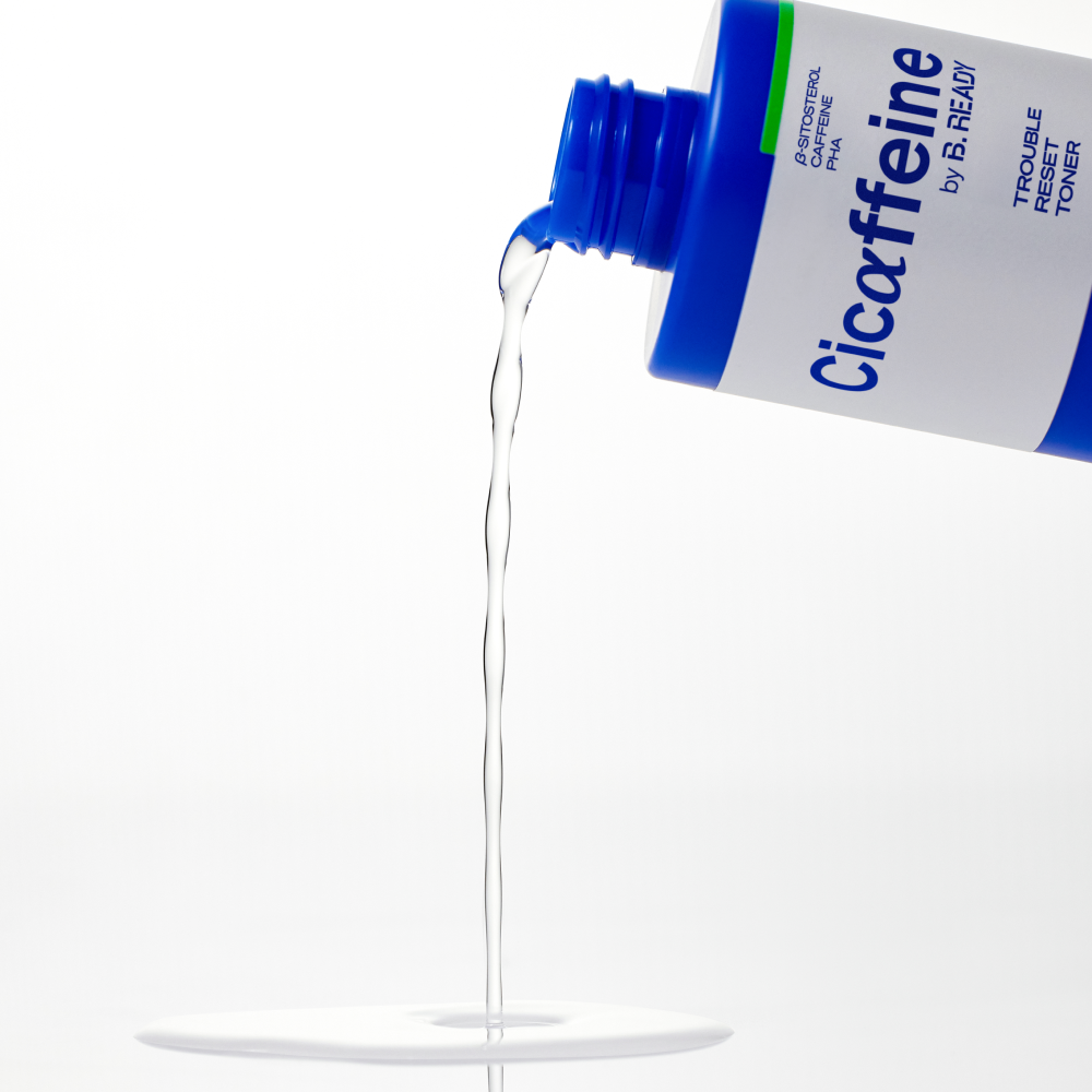 BE.READY Cicaffeine Trouble Reset Toner 250ml pouring clear toner liquid from blue bottle - Gentleman Korea Korean men's skincare product