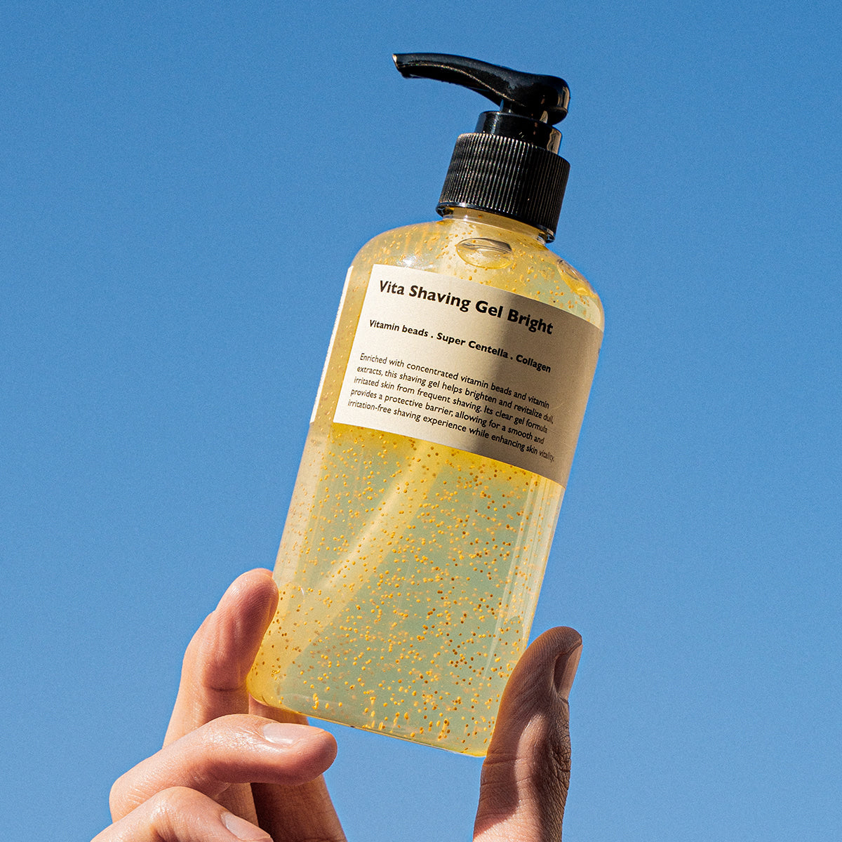 LAZY SOCIETY Vita Shaving Gel Bright 250ml held by hand against blue sky — Gentleman Korea men’s brightening shaving gel